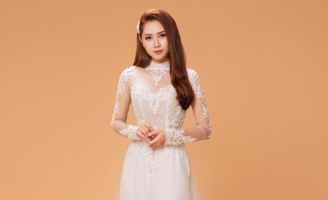Diễn viên Tường Vi làm mẫu cho áo dài Minh Châu